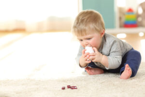 child putting hazard products in the mouth